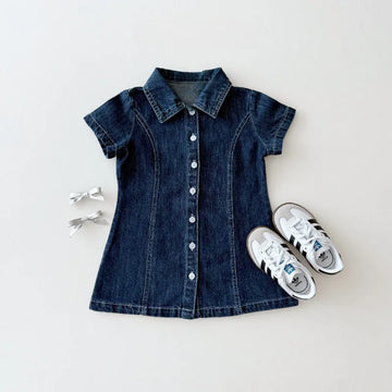 Blue denim dress with white sneakers on a light gray background