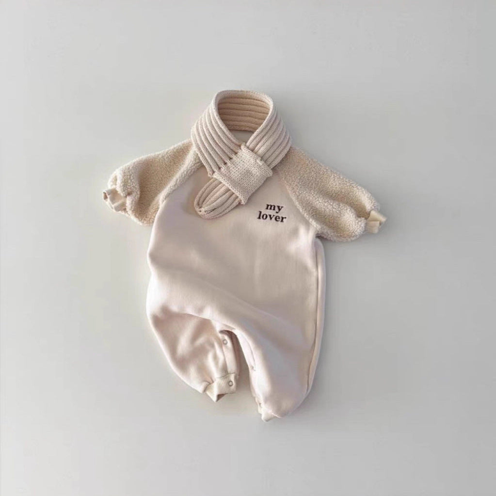 Baby onesie with a bow and 'my lover' text on a light gray background