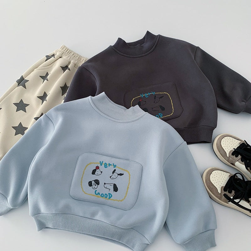 Two children's sweatshirts with embroidered designs on a light gray background.
