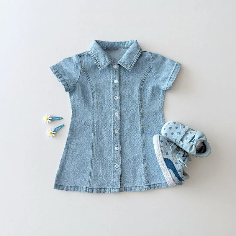 Blue denim dress with white sneakers on a light gray background